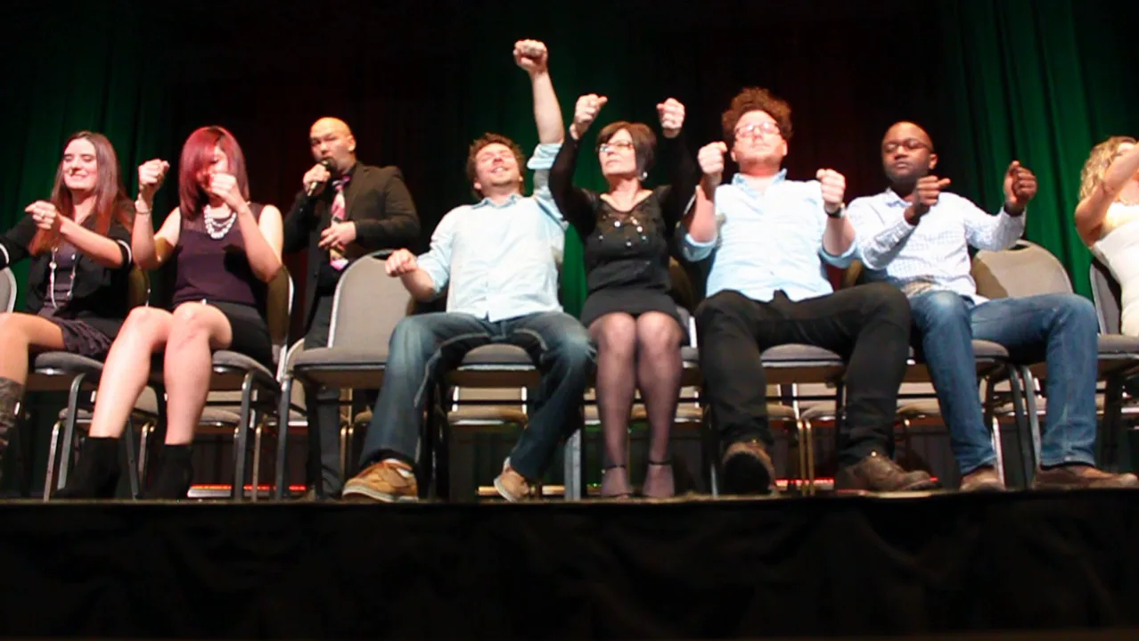 Corporate guests participating on stage at Jesse Lewis comedy hypnosis show
