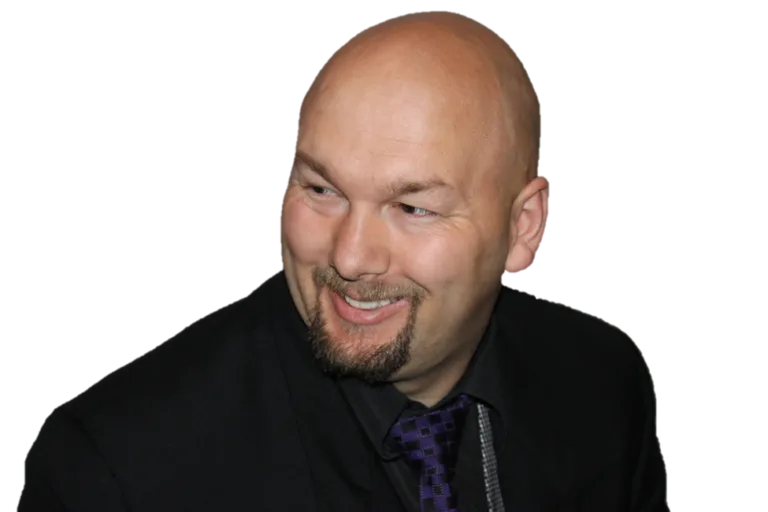 Jesse Lewis smiling in formal attire – professional comedy hypnotist headshot