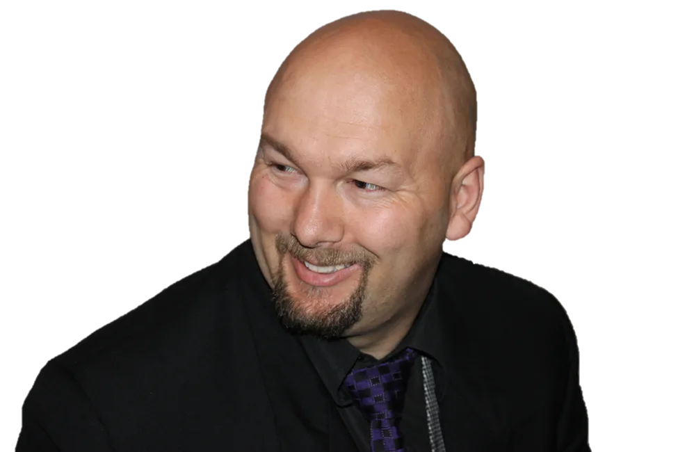 Jesse Lewis in formal attire smiling – comedy hypnotist promotional headshot
