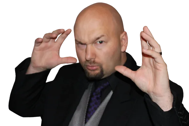 Jesse Lewis in suit making a dramatic hand gesture – comedy hypnotist promotional photo
