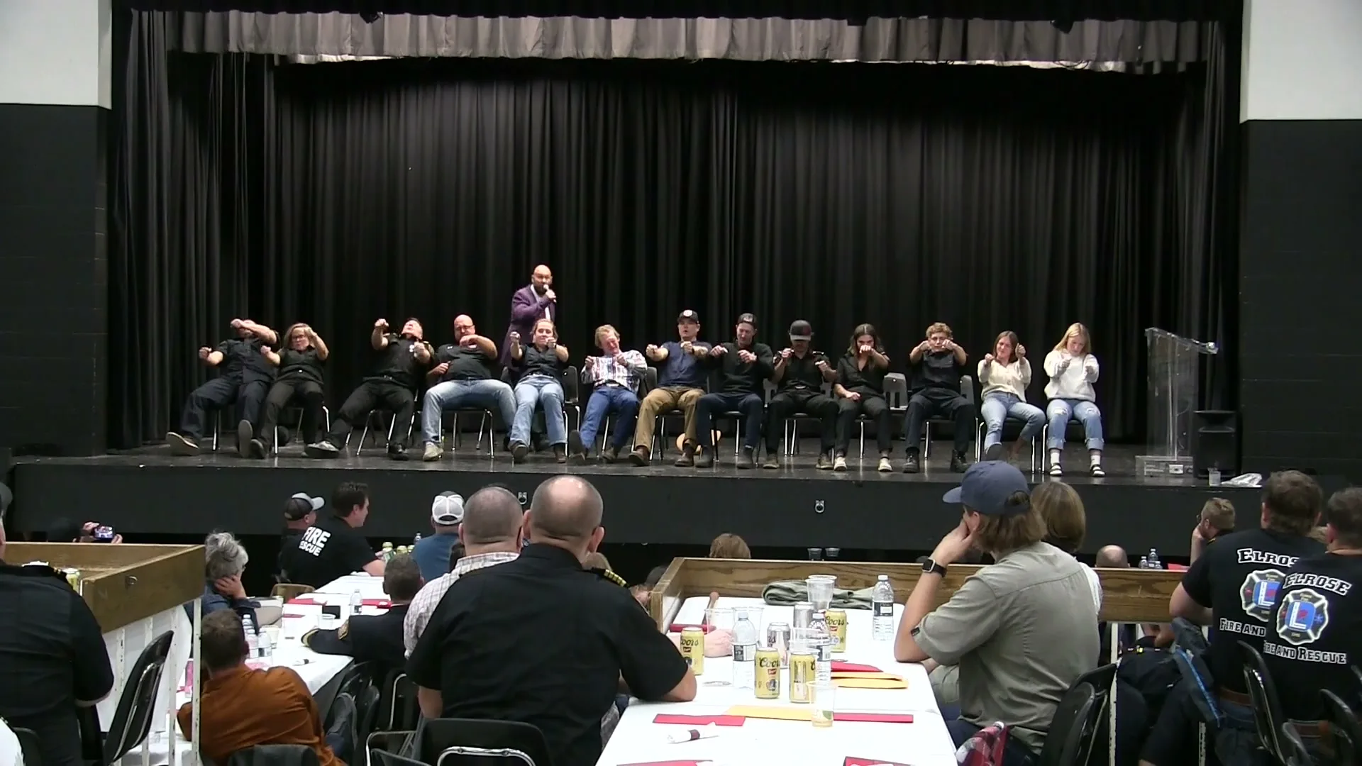 Audience and volunteers laughing during a live Jesse Lewis comedy hypnosis show